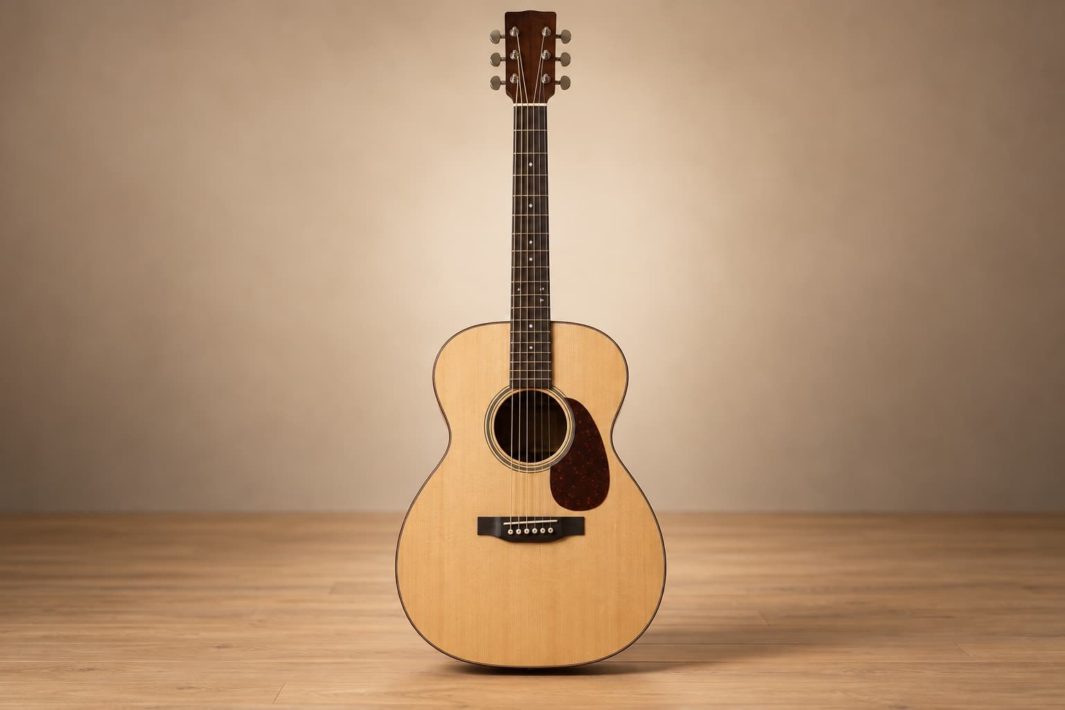 Front view of a grand auditorium acoustic guitar with a defined waist