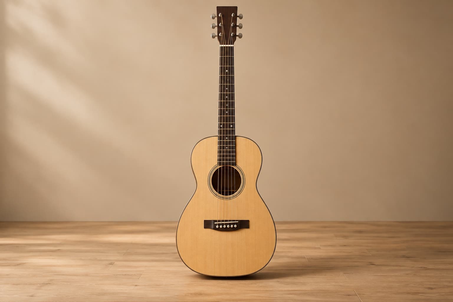 Front view of a narrow compact parlor acoustic guitar